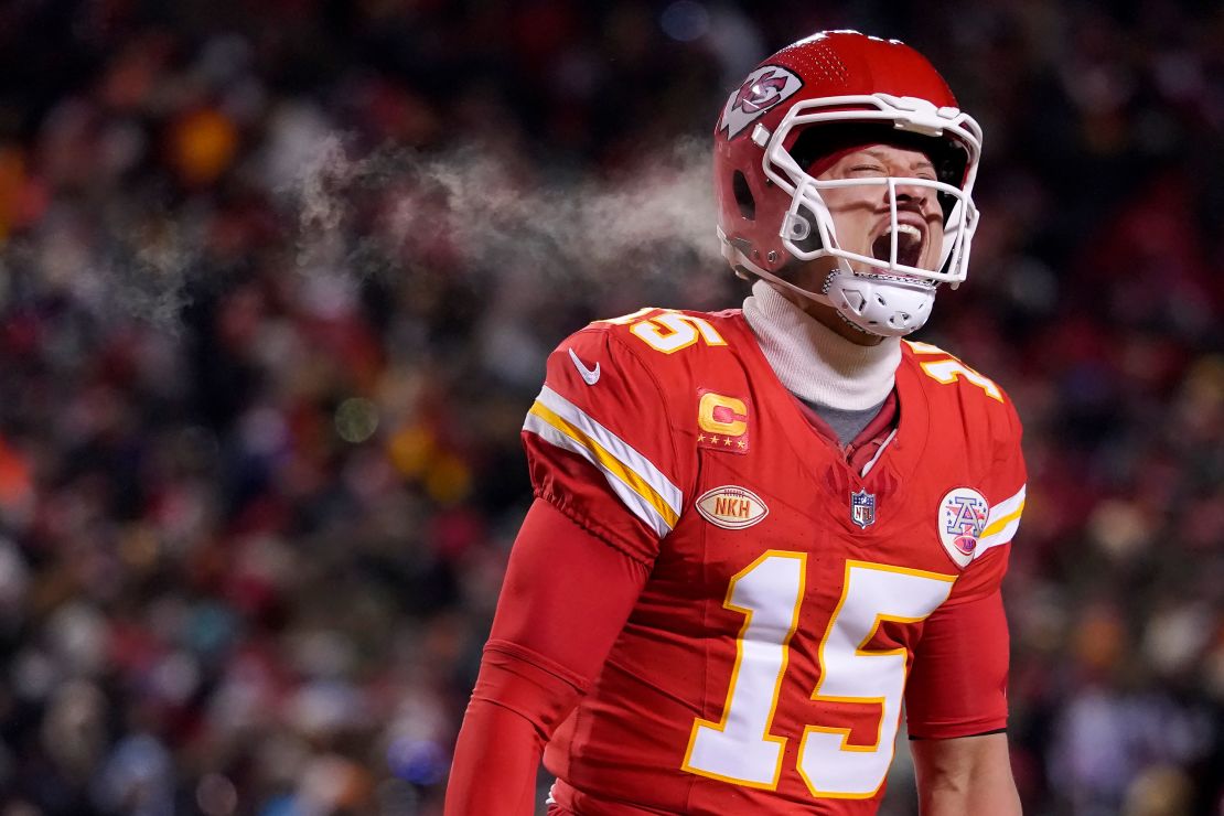 Mahomes celebrates after throwing a touchdown pass during the first half of the Chiefs' Wild Card playoff victory over the Miami Dolphins.