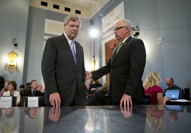 Walz speaks with Agriculture Secretary Tom Vilsack on Capitol Hill in 2015.