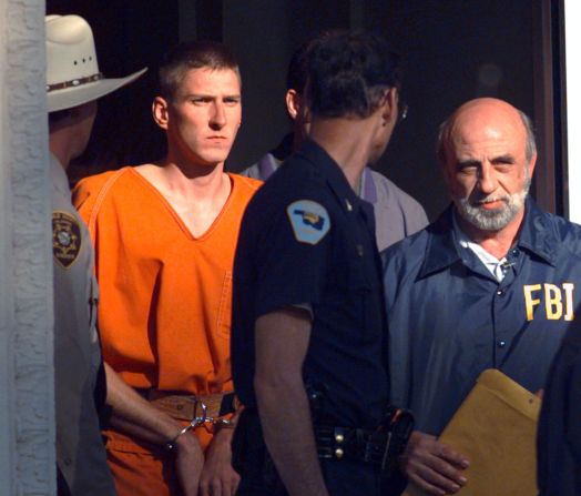 Two days after the bombing, suspect Timothy J. McVeigh is led out of the Noble County Courthouse by state and federal law enforcement officials in Perry, Oklahoma.