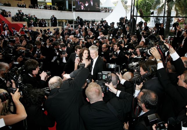 Lynch poses with his girlfriend, Emily Stofle, at the Cannes Film Festival in 2007. The couple married in 2009, and Stofle filed for divorce in 2023. Lynch was married four times.