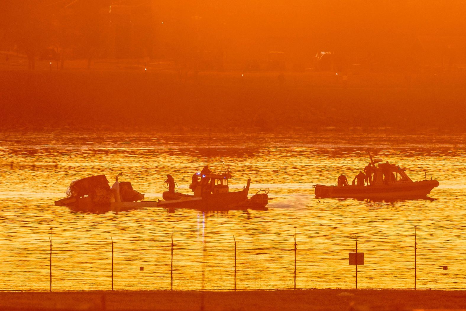 Emergency crews work in the Potomac on Thursday.