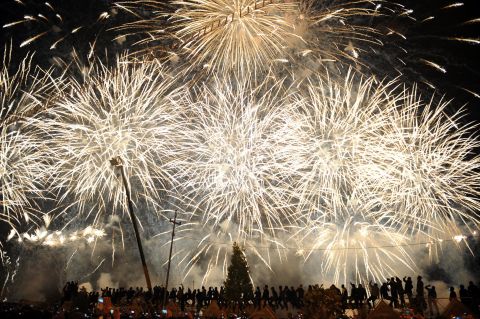 Fireworks explode near the citadel of Arbil during New Year's Eve celebrations in Irbil, Iraqi Kurdish Regional Administration, on January 1.