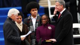 New York City's 109th Mayor, Bill de Blasio, right, is sworn in by former President Bill Clinton, left, as his family watches on Wednesday, January 1 in New York City.