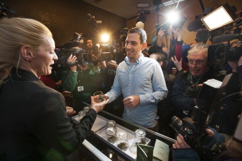 Sean Azzariti, an Iraq war veteran and marijuana activist, becomes the first person to legally purchase recreational marijuana in Colorado on January 1, 2014. Colorado was the first state in the nation to allow retail pot shops. "It's huge," Azzariti said. "It hasn't even sunk in how big this is yet."