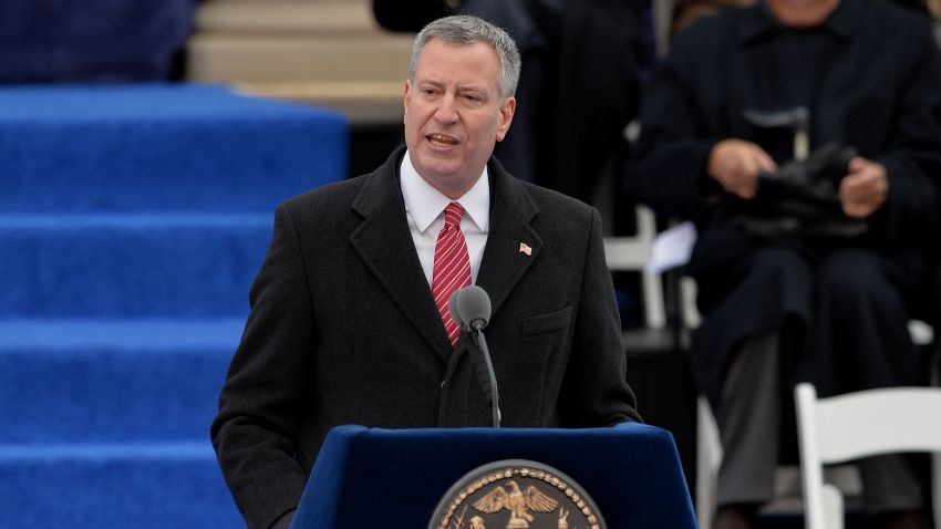 New York City Mayor Bill de Blasio speaks after being sworn in on the steps of City Hall in Lower Manhattan January 1, 2014 in New York. AFP PHOTO/Stan HONDA (Photo credit should read STAN HONDA/AFP/Getty Images)