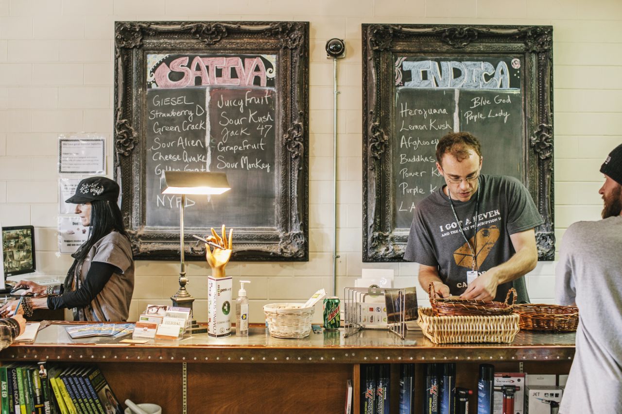 Leica Zayat and Mark Harris serve customers in Evergreen Apothecary.