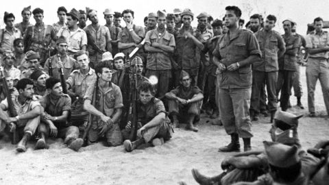 Ariel Sharon addresses troops of Unit 101 before their attack on Khan Yunis in what was formerly known as the Gaza Strip on August 30, 1955. Sharon had established the elite commando group two years before. The officer-turned-politician had a career marked with victories and controversies.