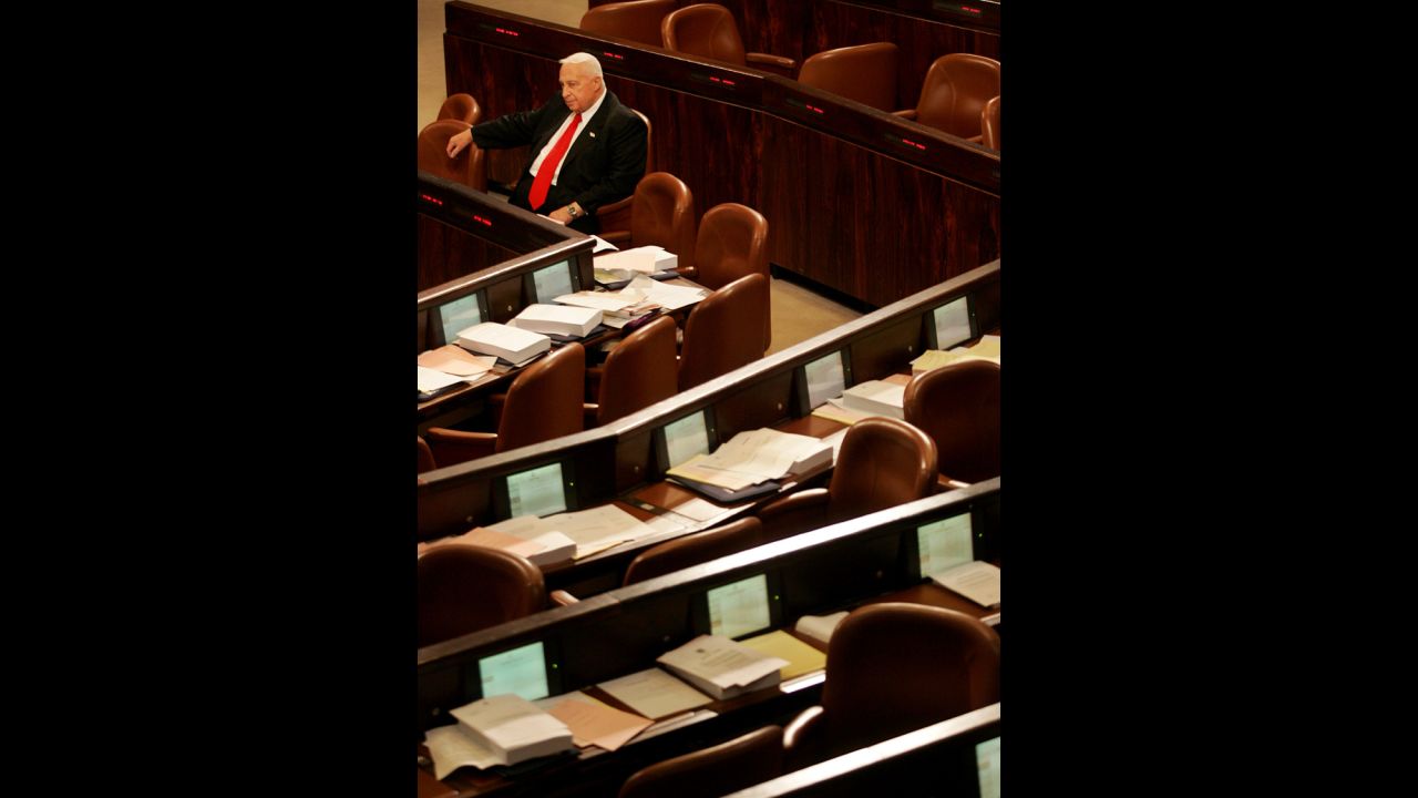 Sharon sits alone as he waits for other Knesset members to arrive for a vote on March 28, 2005. Sharon pushed for Israel's historic 2005 withdrawal from 25 settlements in the West Bank and Gaza, which was turned over to Palestinian rule for the first time in 38 years.