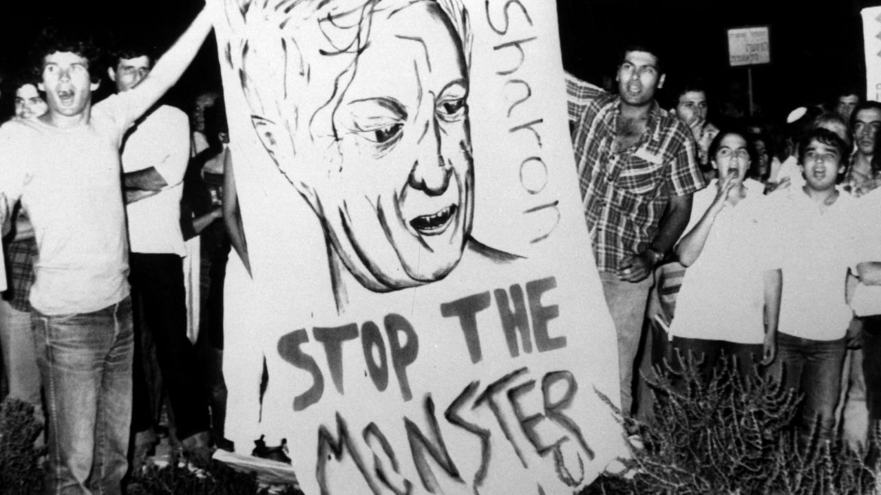An official Israeli inquiry found Sharon indirectly responsible for the September 1982 killings of as many as 2,000 Palestinians at the Sabra and Shatila refugee camps outside of Beirut, Lebanon. The report -- which led to Sharon's prompt resignation -- determined the then-defense minister did nothing to stop Christian militiamen allied with Israel from entering the camps. Here, demonstrators are seen near Prime Minister Menachem Begin's home in Jerusalem, calling for the resignations of Begin and Sharon.