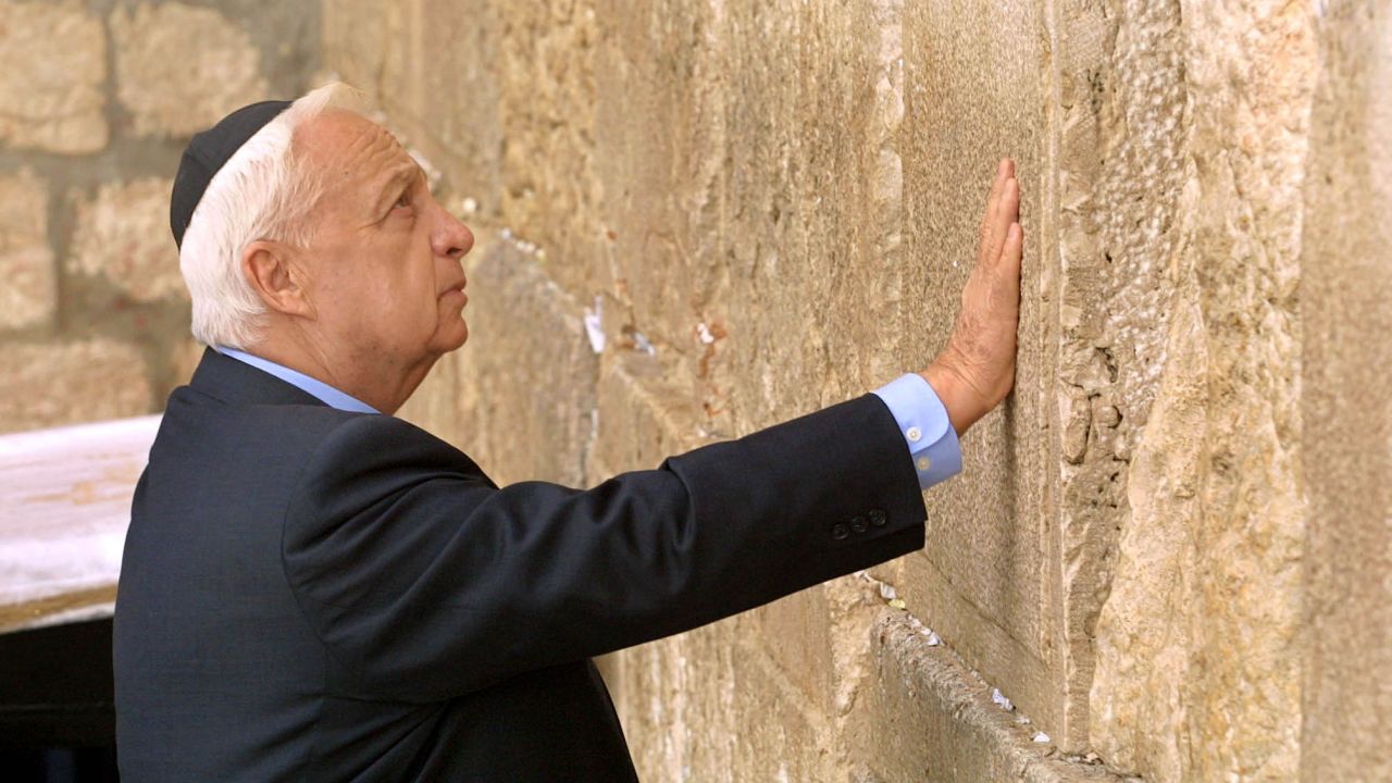 Sharon made a political comeback in the 1990s, eventually becoming leader of the Likud party in 2000. In February 2001, the prime minister-elect touches the ancient stones of the Western Wall as he prays at Judaism's holiest site in Jerusalem. He took office the following month.