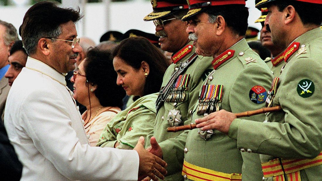 Musharraf shakes hands with military officials in 2001.