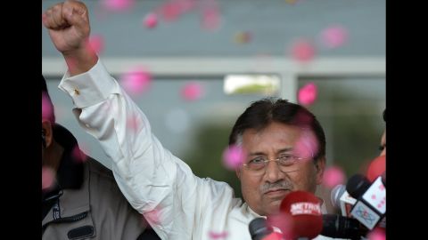 Musharraf greets supporters outside the airport in Karachi, Pakistan, on March 24, 2013. With three court cases pending against him, Musharraf returned to Pakistan after four years of exile. He was granted bail in advance of his arrival, so he was not arrested. 