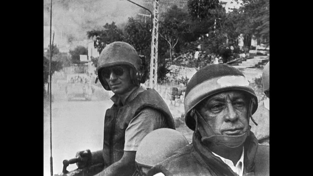 Israeli Defense Minister Ariel Sharon, in combat helmet and flak jacket, leads his troops toward a meeting with Christian forces in East Beirut in June 1982. Israel had invaded southern Lebanon in retaliation for an assassination attempt linked to the group Abu Nidal.