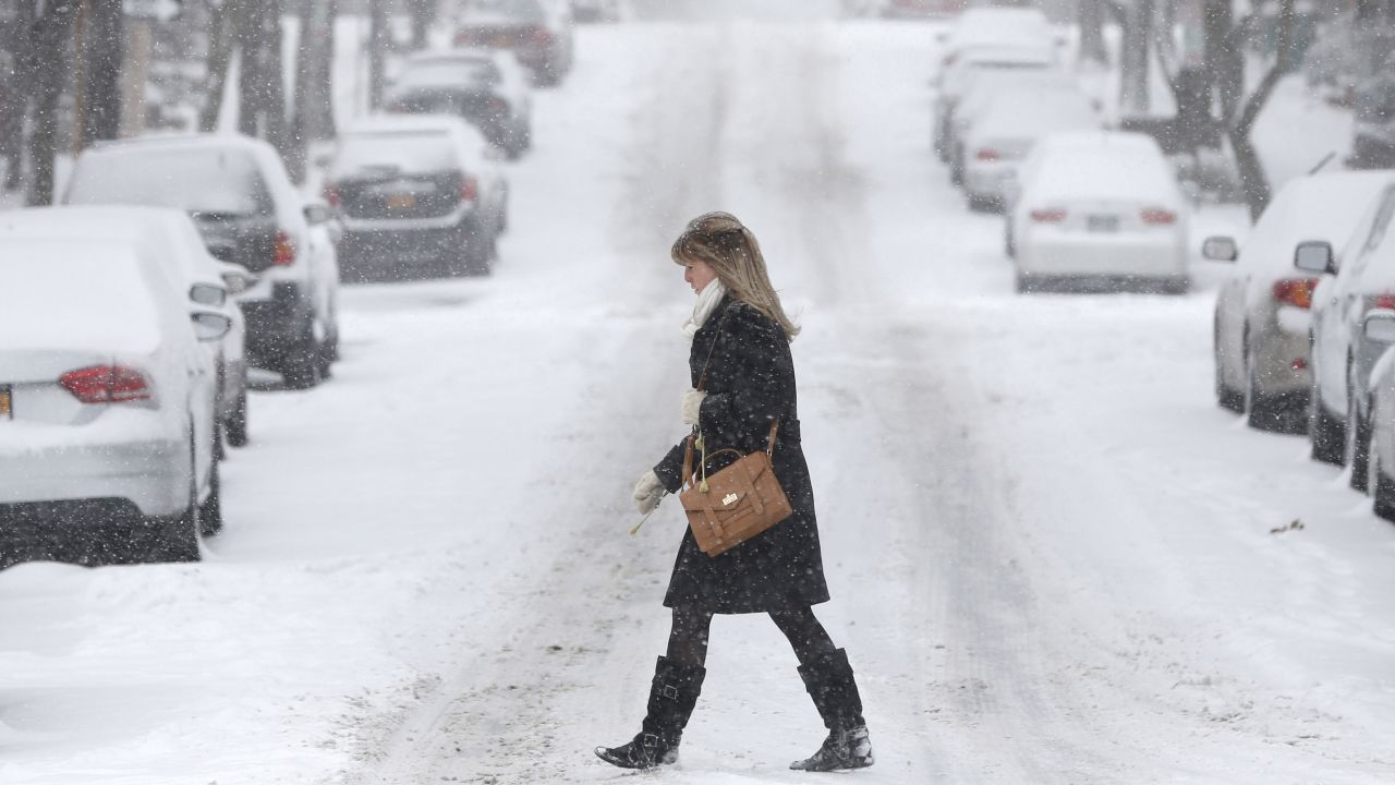 A woman walks through snowy conditions in Albany on January 2.