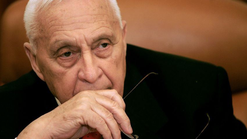 Then-Israeli Prime Minister Ariel Sharon attends a ceremony completing the sale of Bank Leumi to a private U.S. investment group at his office in Jerusalem on January 4, 2006.