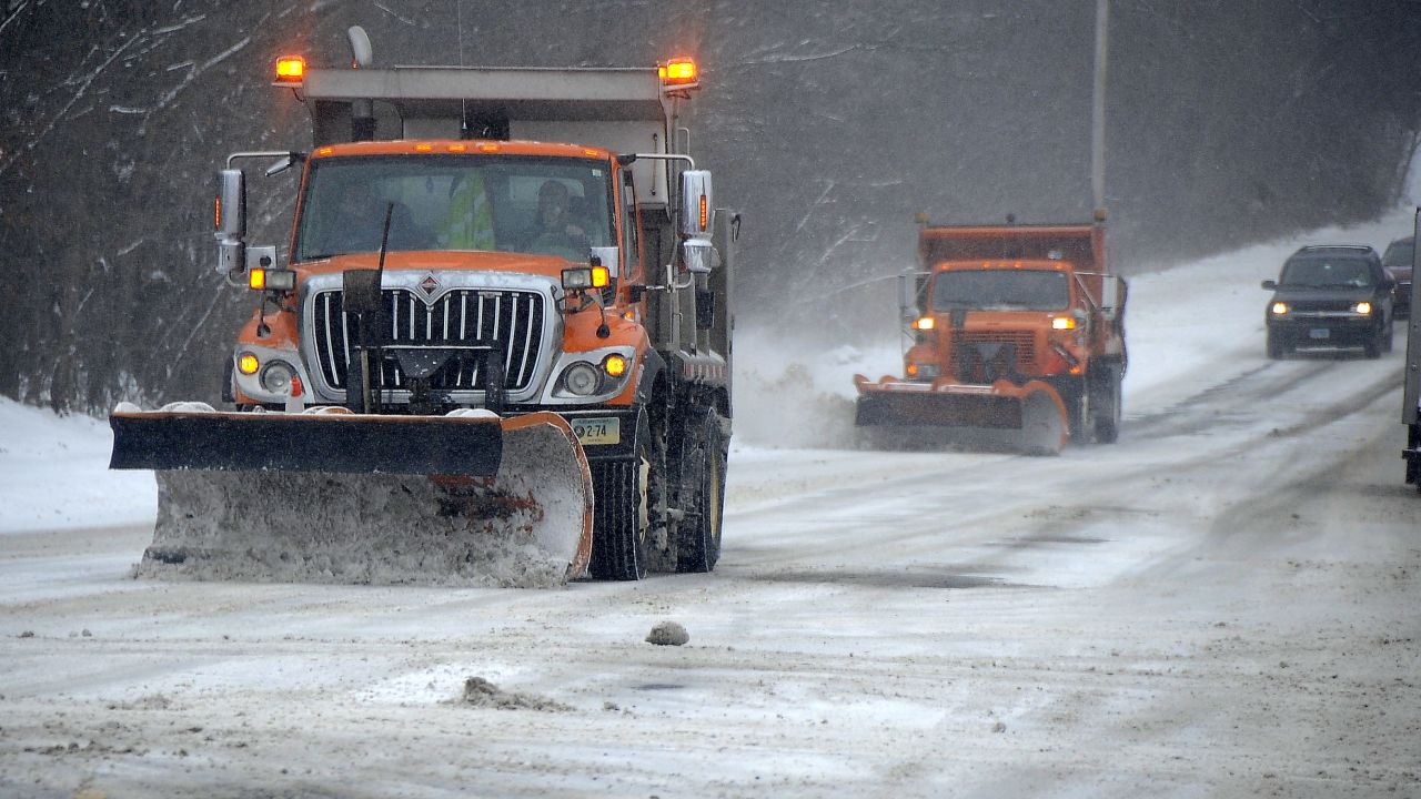 Trucks clear snow off the roads in Torrington, Connecticut, on January 2.