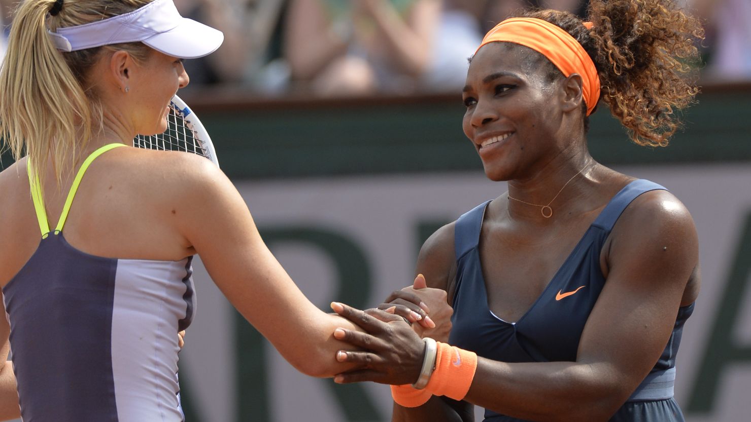 Serena Williams and Maria Sharapova exchange handshakes following the American's victory at the 2013 French Open final.