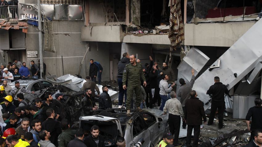 Lebanese people gather at the site of a car bomb that targeted Beirut's southern suburb of Haret Hreik on January 2, 2014.