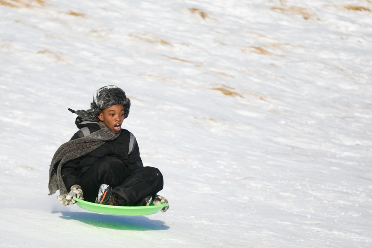 Dallas Todd, 11, flies down a snowy hill at Lake Harbor Park in Norton Shores, Michigan, on January 2.