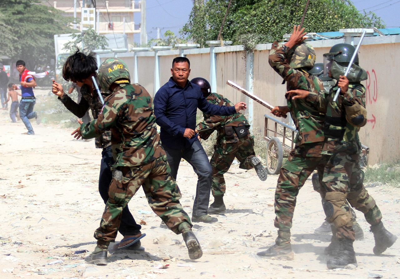 Cambodian soldiers clash with protesters during a rally by garment workers calling for higher wages in front of a factory in Phnom Penh on January 2.