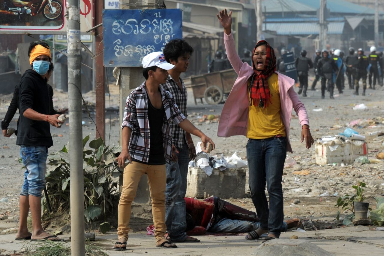 A woman calls for help after a protester was wounded in violence in Phnom Penh on January 3.