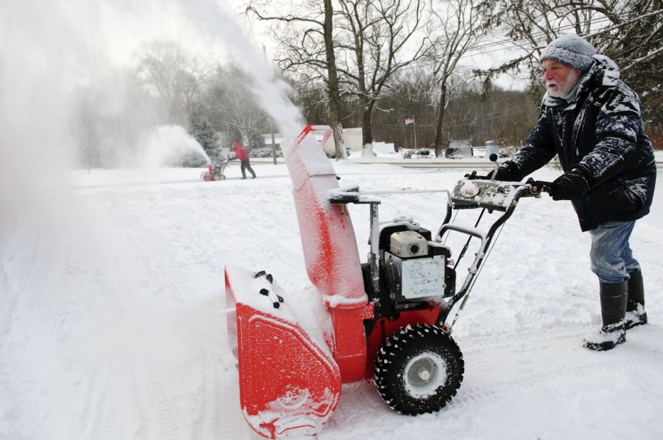 A man uses his snowblower to clear some paths in Mansfield, Connecticut, on January 3.