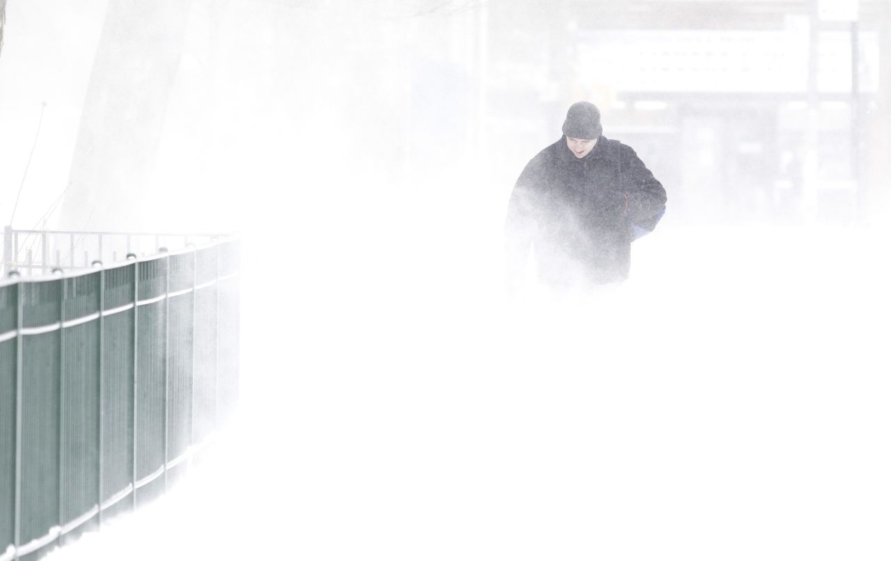 A man walks through the snow as the wind kicks it up January 3 in New York City.