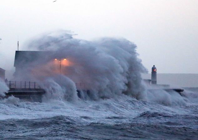 Huge waves crash against the promenade wall in Porthcawl, Wales, on January 3. 