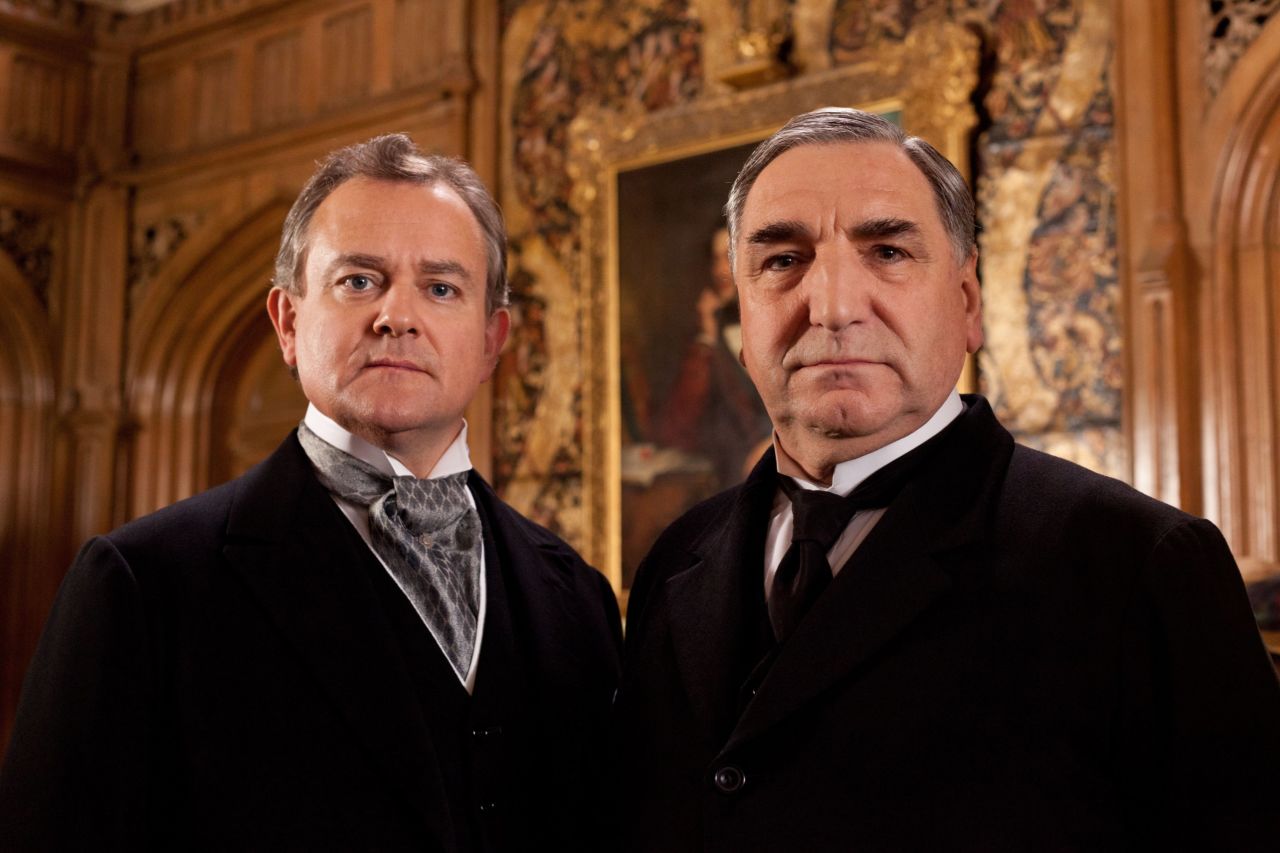 Lord Grantham (Hugh Bonneville, left) is trying to keep the estate in a financially sound place while adapting to the inevitable tide of progress. (Jim Carter, right, plays the dutiful Mr. Carson.)