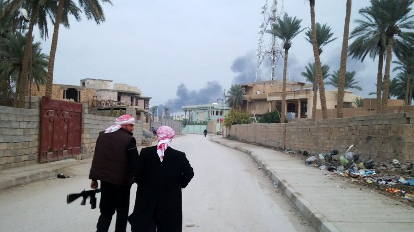 Armed tribesmen stand guard in a street as clashes rage on in the Iraqi city of Ramadi, West of Baghdad, on January 2, 2014. Iraqi special operations forces were fighting in the city of Fallujah, half of which is reportedly under the control of militants linked to Al-Qaeda, their commander said. AFP PHOTO/AZHAR SHALLALAZHAR SHALLAL/AFP/Getty Images