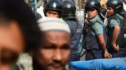 Bangladeshi policemen look on as devotees arrive for Friday prayers at a mosque in Dhaka on January 3, 2014. More than three-quarters of Bangladeshis are opposed to this weekend's general election which is being boycotted by the main opposition, a poll showed Friday. Policemen were deployed throughout the city in anticipation to confront any civil unrest. AFP PHOTO/Roberto SCHMIDTROBERTO SCHMIDT/AFP/Getty Images