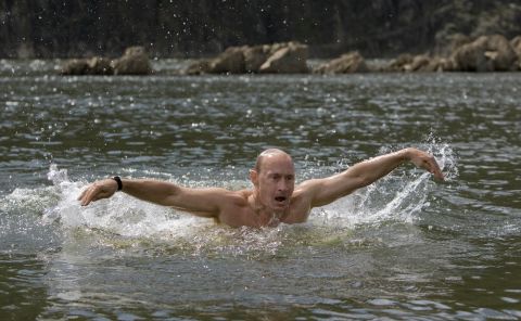 Putin braved the waters in southern Siberia during a vacation to show off his swimming skills.