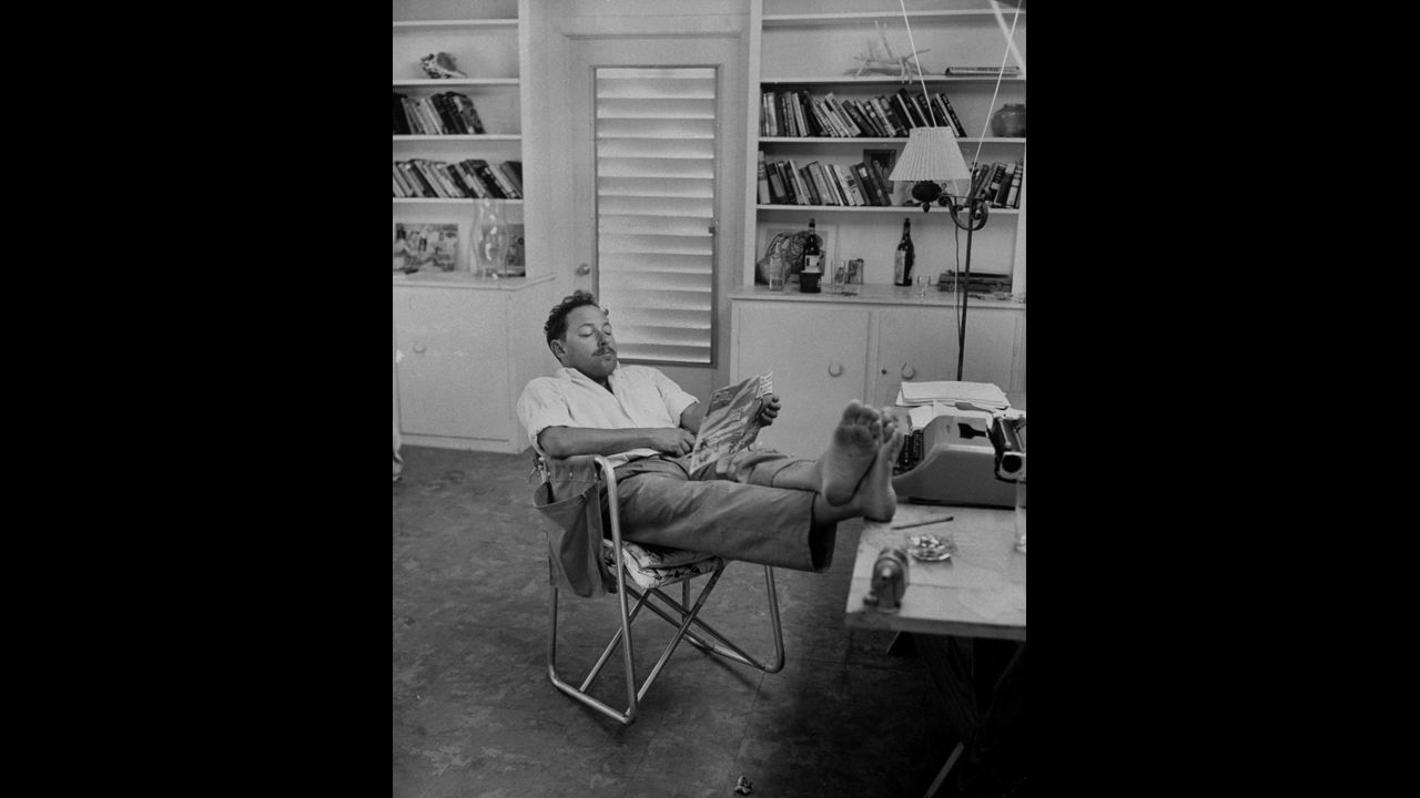 Playwright Tennessee Williams, creator of "The Glass Menagerie" and "A Streetcar Named Desire," relaxes at his home in this undated photo.