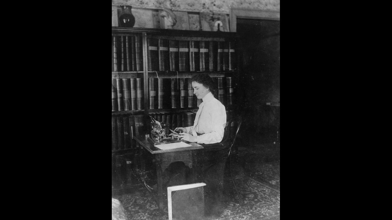 Helen Keller, the blind and deaf author and lecturer, sits at her typewriter in this undated photo.