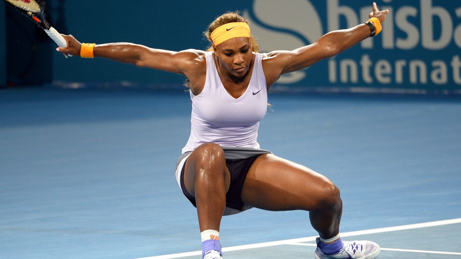 Serena Williams took a tumble Saturday but still beat Victoria Azarenka to capture the Brisbane title. 