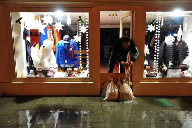Water is mopped up from a shop in Brittany, France, on January 4. 