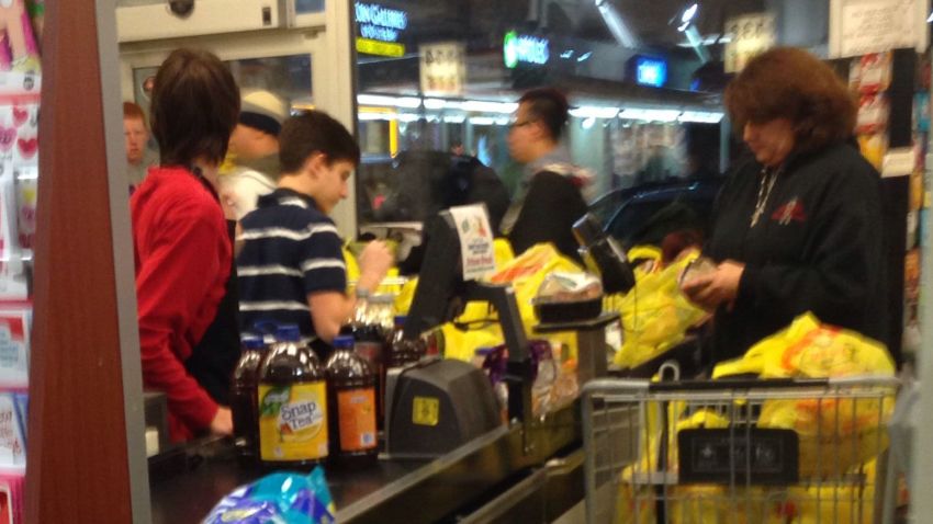 Local New Yorkers rush to grocery stores to prepare for the storm on January 2, 2014.