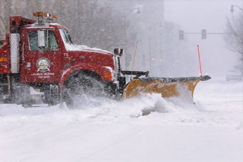 A city snowplow clears the street in an almost-deserted downtown Springfield on January 5.