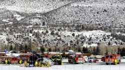 Emergency crews work near a passenger plane that crashed upon landing at the Aspen-Pitkin County Airport in Aspen, Colo., Sunday, Jan. 5, 2014. (AP Photo/The Aspen Times, Leigh Vogel)