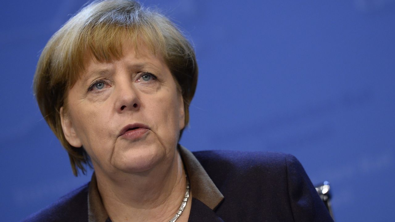 German Chancellor Angela Merkel gives a press conference in Brussels on December 20, 2013.