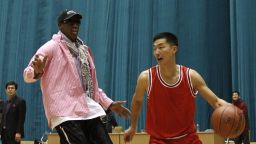 Former NBA basketball star Dennis Rodman plays one-on-one with north Korean player during a basketball practice session in Pyongyang, North Korea on Friday, Dec. 20, 2013. Rodman selected the members of the North Korean team who will play in Pyongyang against visiting NBA stars on Jan. 8, 2014, the birthday of North Korean leader Kim Jong Un. (AP Photo/Kim Kwang Hyon)