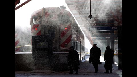 Metra employees in Chicago walk around LaSalle Street Station on January 6.
