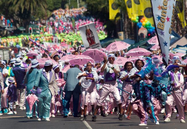 The minstrels' parade kicked off in the morning, as performers marched through the city dressed in colorful uniforms and carrying umbrellas.