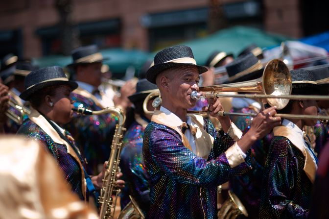 A wide variety of instruments, including trumpets, saxophones and banjos, accompany the parading troupes across the city. 
