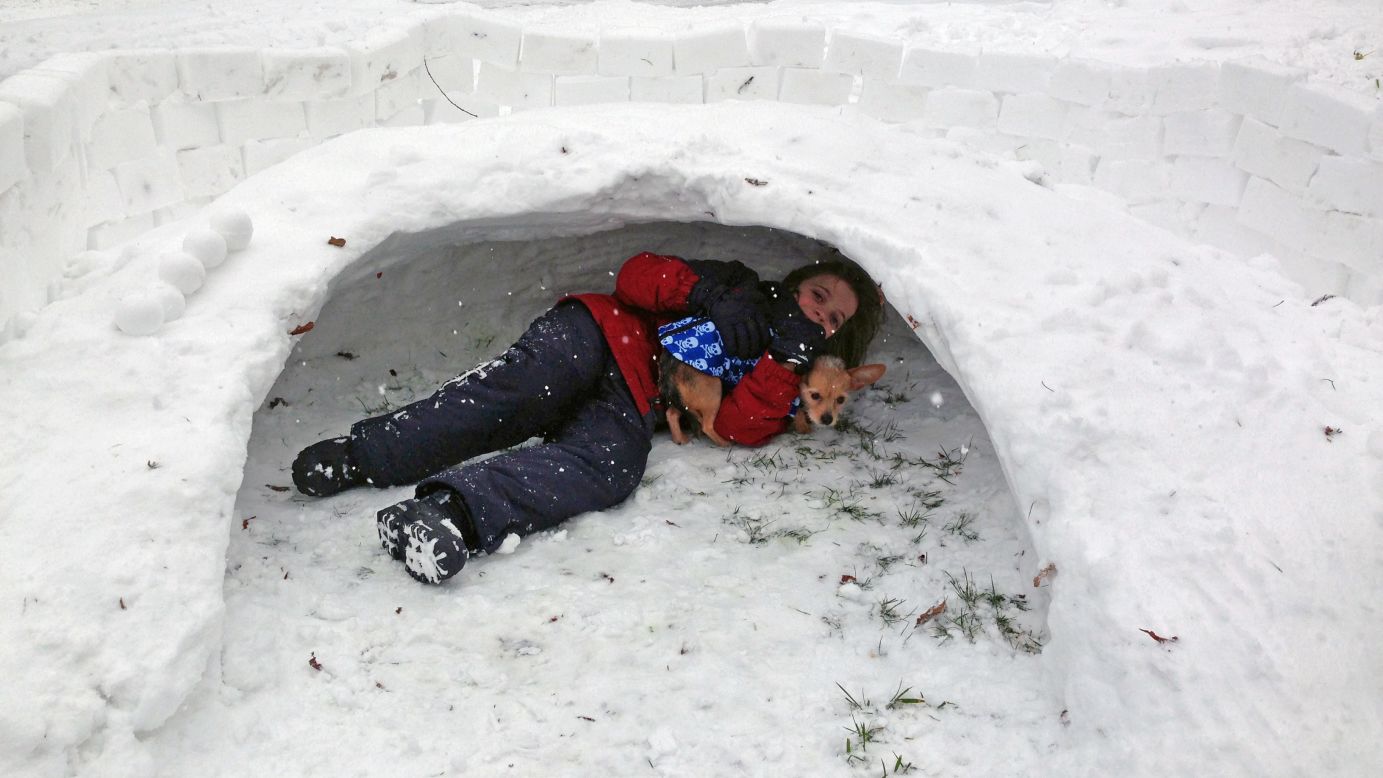 CNN iReporter Joy Lewandowski's son Matt plays in a snow fort built by kids on her street on January 5. School was canceled Monday. 