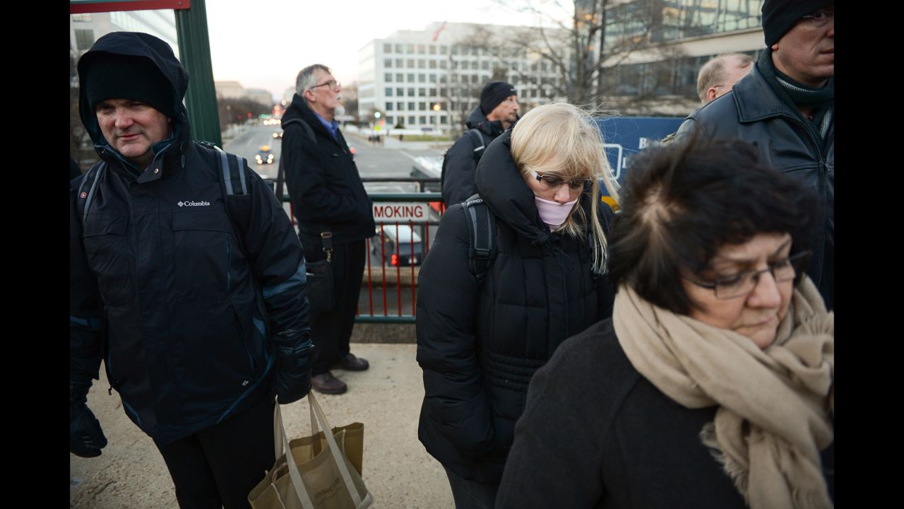 Commuters wait for a Virginia Railway Express train to arrive at Washington's L'Enfant Plaza on January 6.