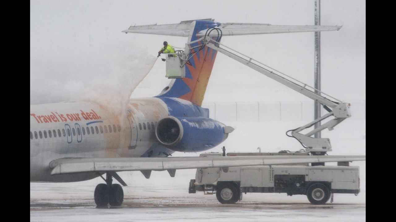 A jet is de-iced at Gerald R. Ford International Airport in Grand Rapids, Michigan, on January 6.