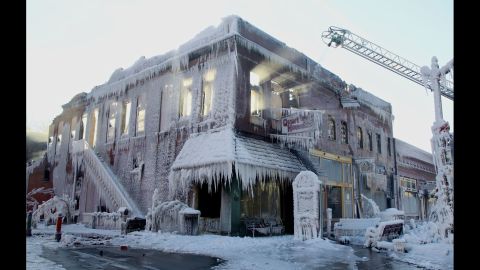 Sunlight beams through the windows of a building that caught on fire Friday, January 3, in Plattsmouth, Nebraska. The firefighters' water froze all over the building.