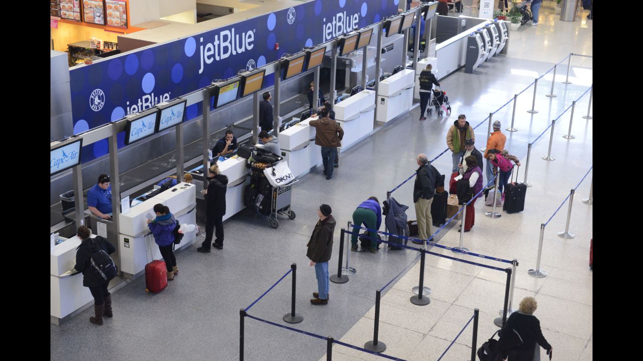 JetBlue passengers in Boston wait for normal flights to resume at Logan International Airport on January 7.