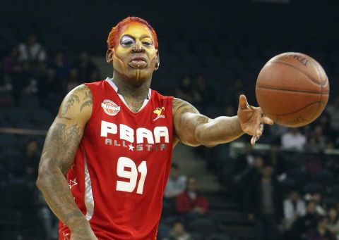 Rodman wears face paint in 2011 while playing a basketball game with other NBA greats in Macau.